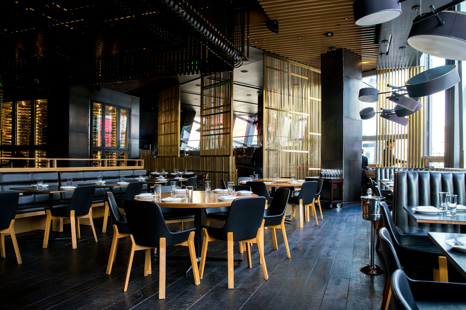 Warmly lit restaurant interior with hanging pendant lights